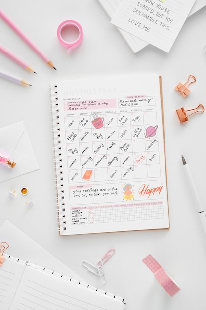 Free photo paper planner bullet journal with stationery