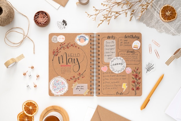 Free photo paper planner bullet journal with stationery