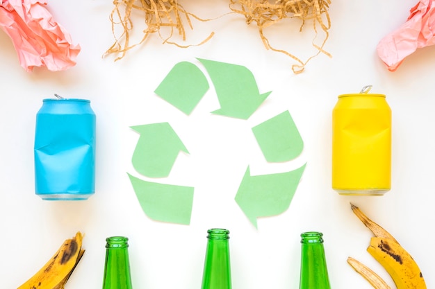 Paper recycle logo with colorful garbage 