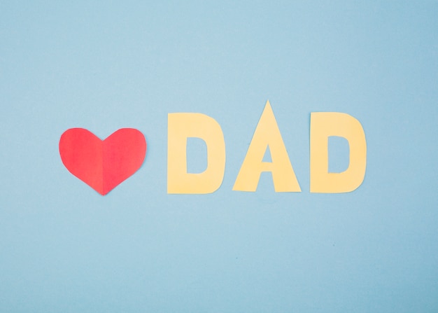 Free photo paper red heart and dad title