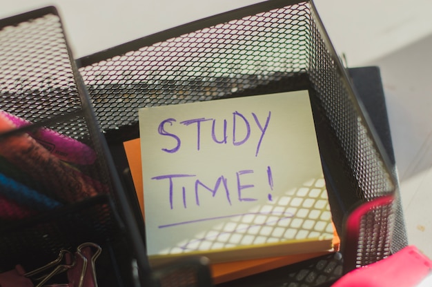 Paper reminder in organizer saying 'Study time'