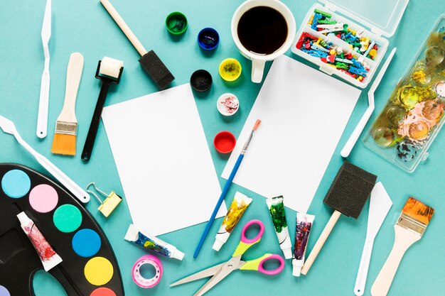 Paper sheet and painting color palette on desk