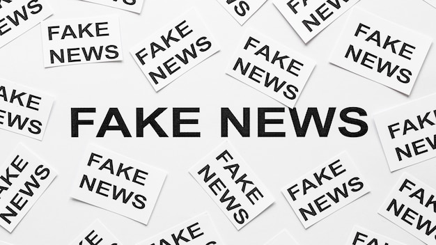 Free photo paper sheets with fake news message