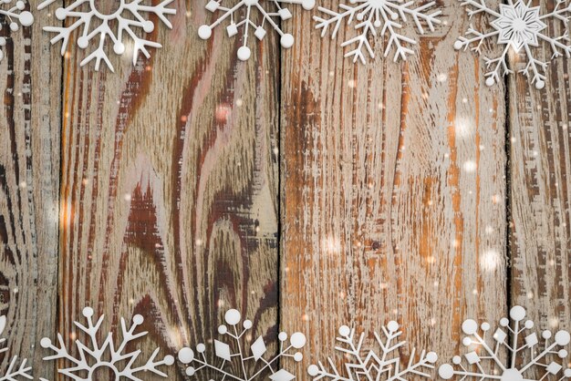 Paper snowflakes on wooden background