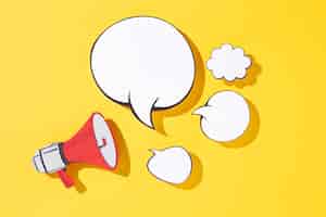 Free photo paper style megaphone and speech bubbles