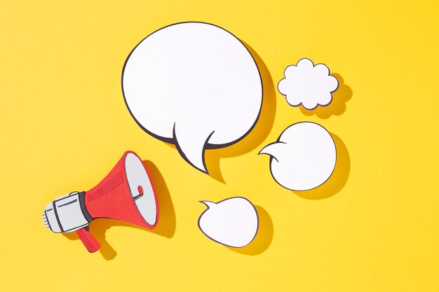 Paper style megaphone and speech bubbles