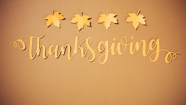 Free photo paper thanksgiving lettering with small leaflets