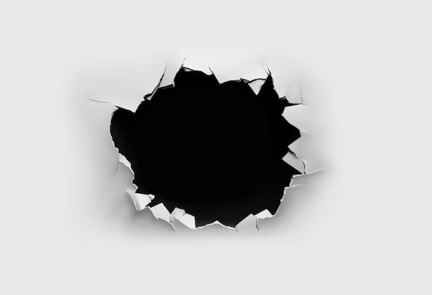 paper torn up with a black hole in the middle