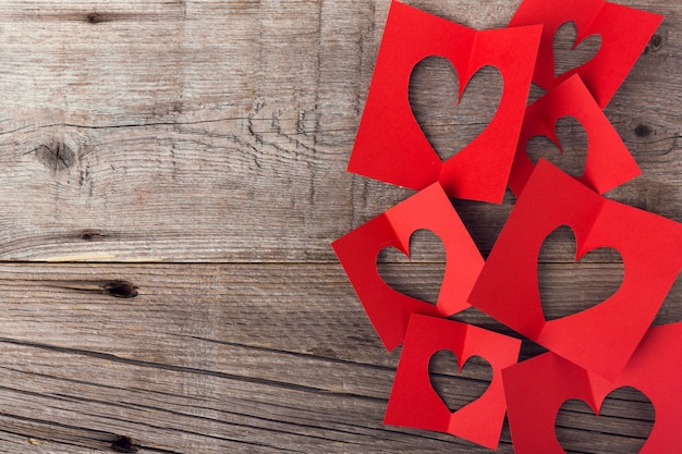 Paper valentines day hearts on wooden