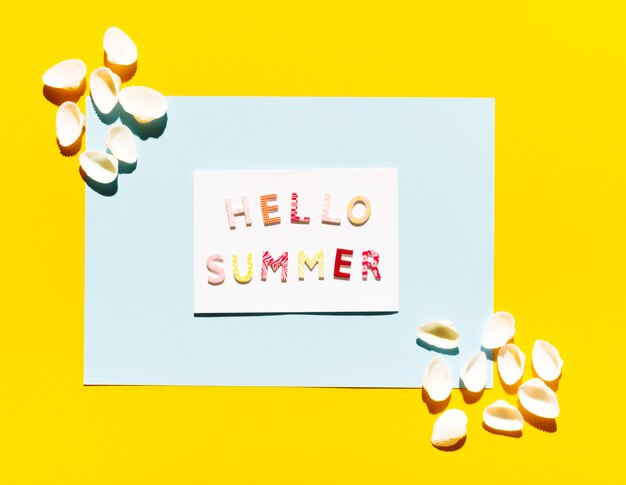 Paper with lettering Hello Summer and seashells
