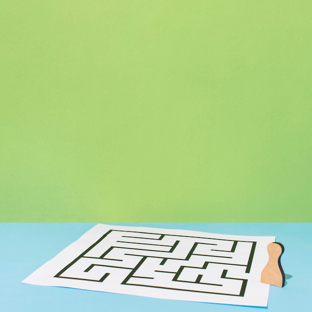 Free photo paper with maze high angle