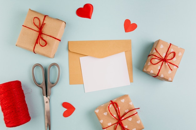 Paper with small gift boxes and hearts