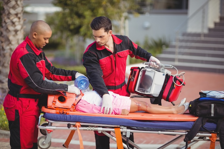 Free Photo paramedic giving oxygen to injured girl