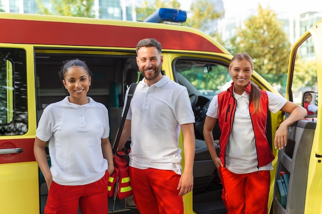 Paramedics at work with an ambulance Paramedic nurse and emergency doctor at ambulance with kit