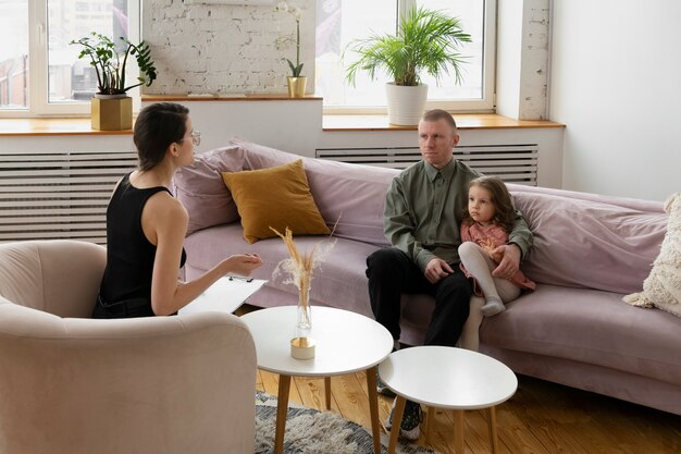 Parent and kid talking to psychologist