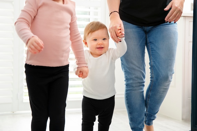 Free photo parent and kids walking together