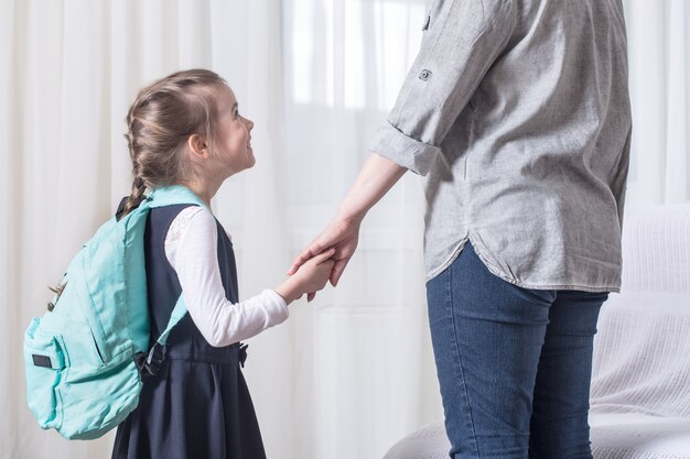 Parent and primary school student go hand in hand