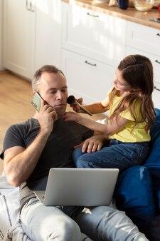 Parent trying to work from home surrounded by kids