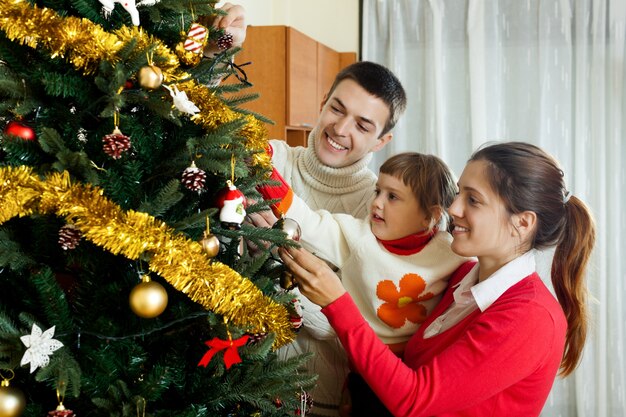 Parents and child preparing for Christmas