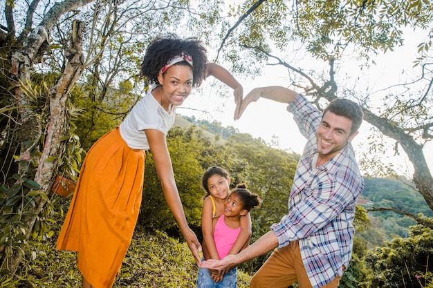 Parents forming heart with arms