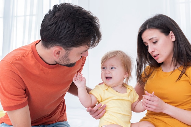 Parents holding smiling baby