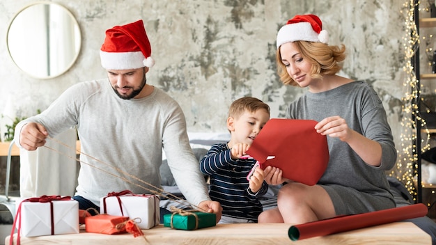 Parents and kid being together on christmas day