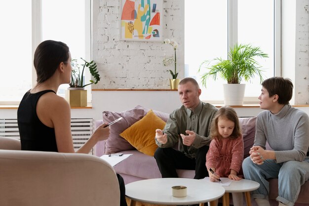 Parents and kid doing therapy