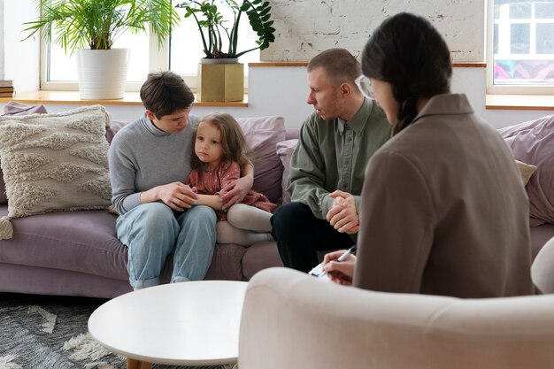 Parents and kid doing therapy