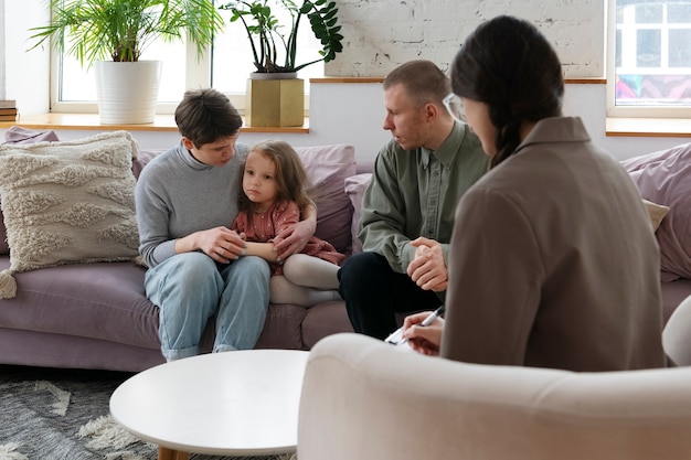 Parents and kid doing therapy