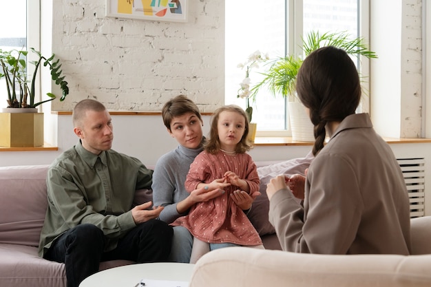Parents and kid doing therapy