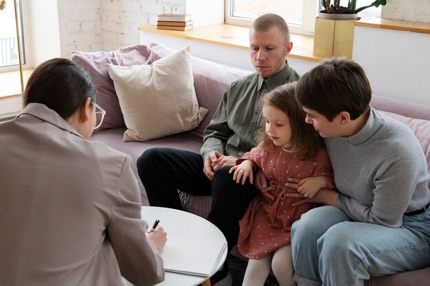 Parents and kid doing therapy