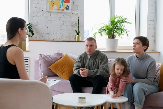 Parents and kid doing therapy