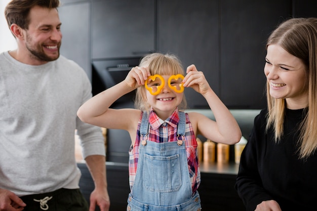 Free photo parents looking at funny girl