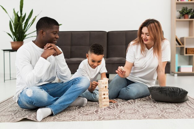 Parents playing a game with their son