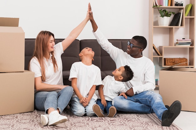 Parents playing together with their children