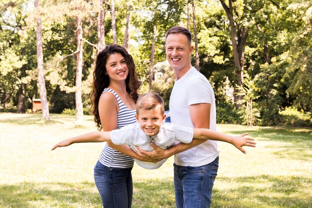 Parents playing with their son