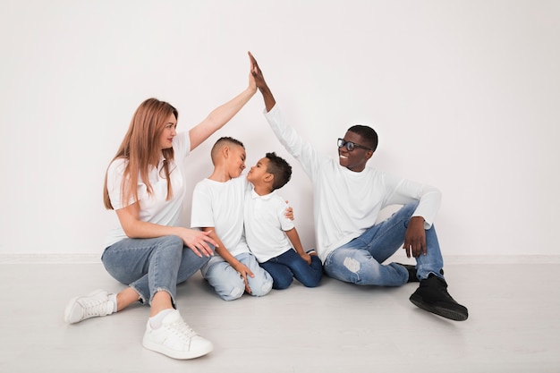 Parents spending time together with their kids indoors