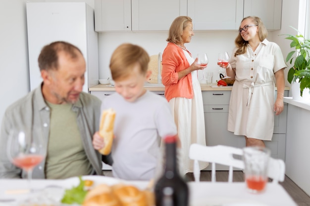 Parents spending time with their daughter and grandson at home