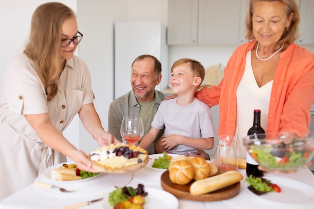 Parents spending time with their daughter and grandson at home