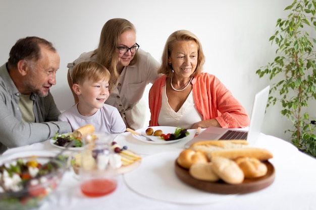 Parents spending time with their daughter and grandson at home