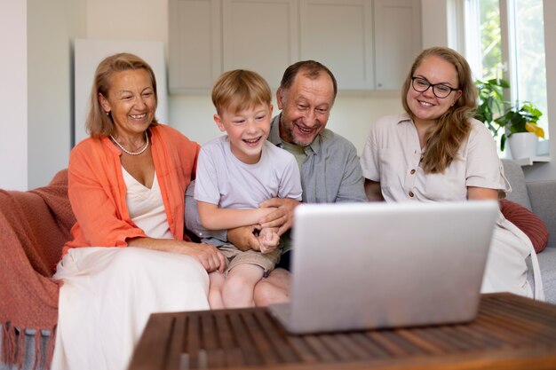 Parents spending time with their daughter and grandson at home