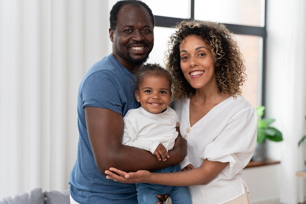 Parents spending time with their daughter at home