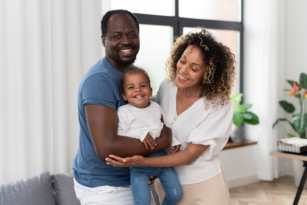 Parents spending time with their daughter at home