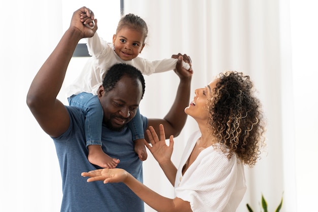 Parents spending time with their daughter