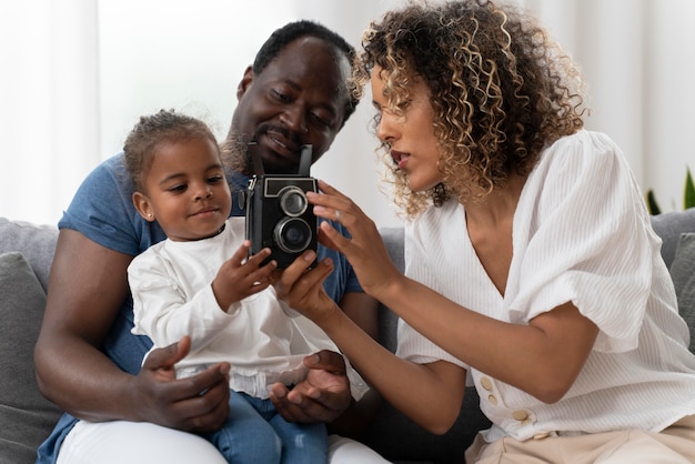 Parents spending time with their little daughter at home