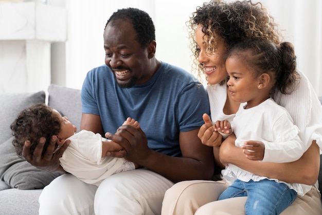 Free photo parents spending time with their little daughters