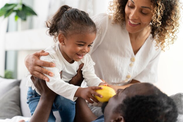 Parents spending time with their little girl at home