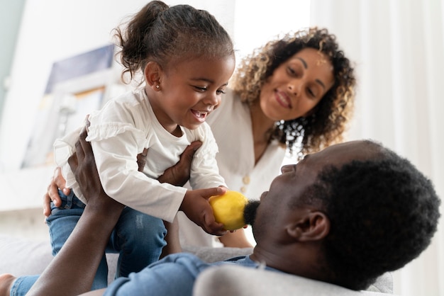 Free photo parents spending time with their little girl