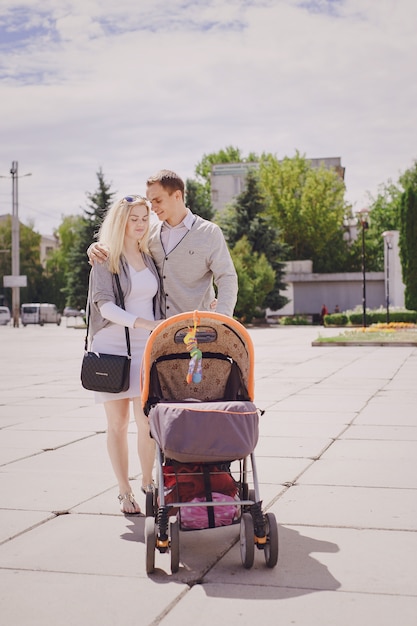 Parents strolling a baby stroller