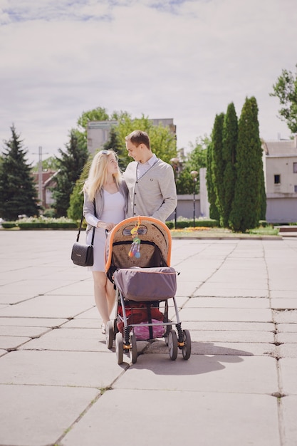 Parents strolling a baby stroller